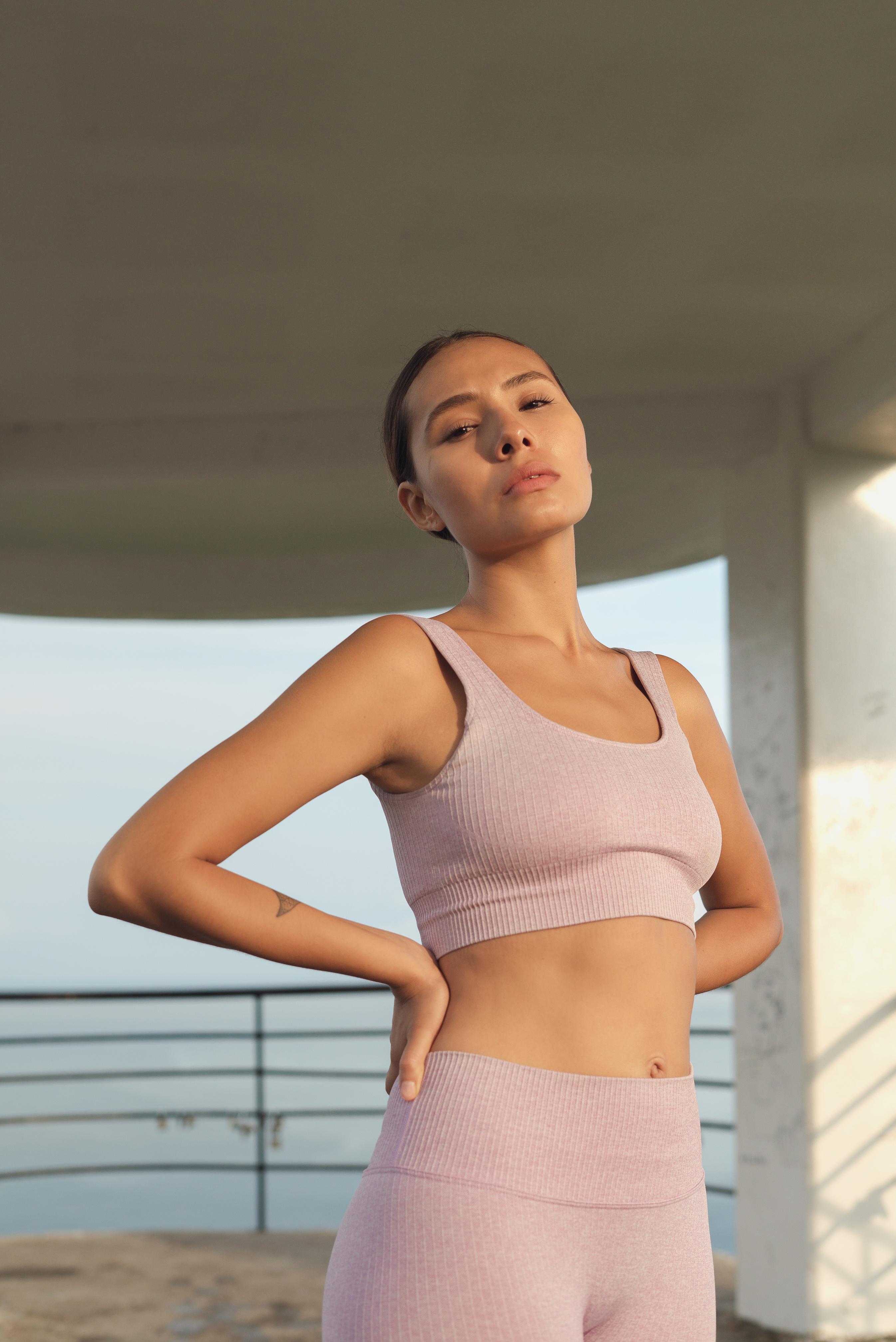 Fit Woman Standing With Hands on Hip