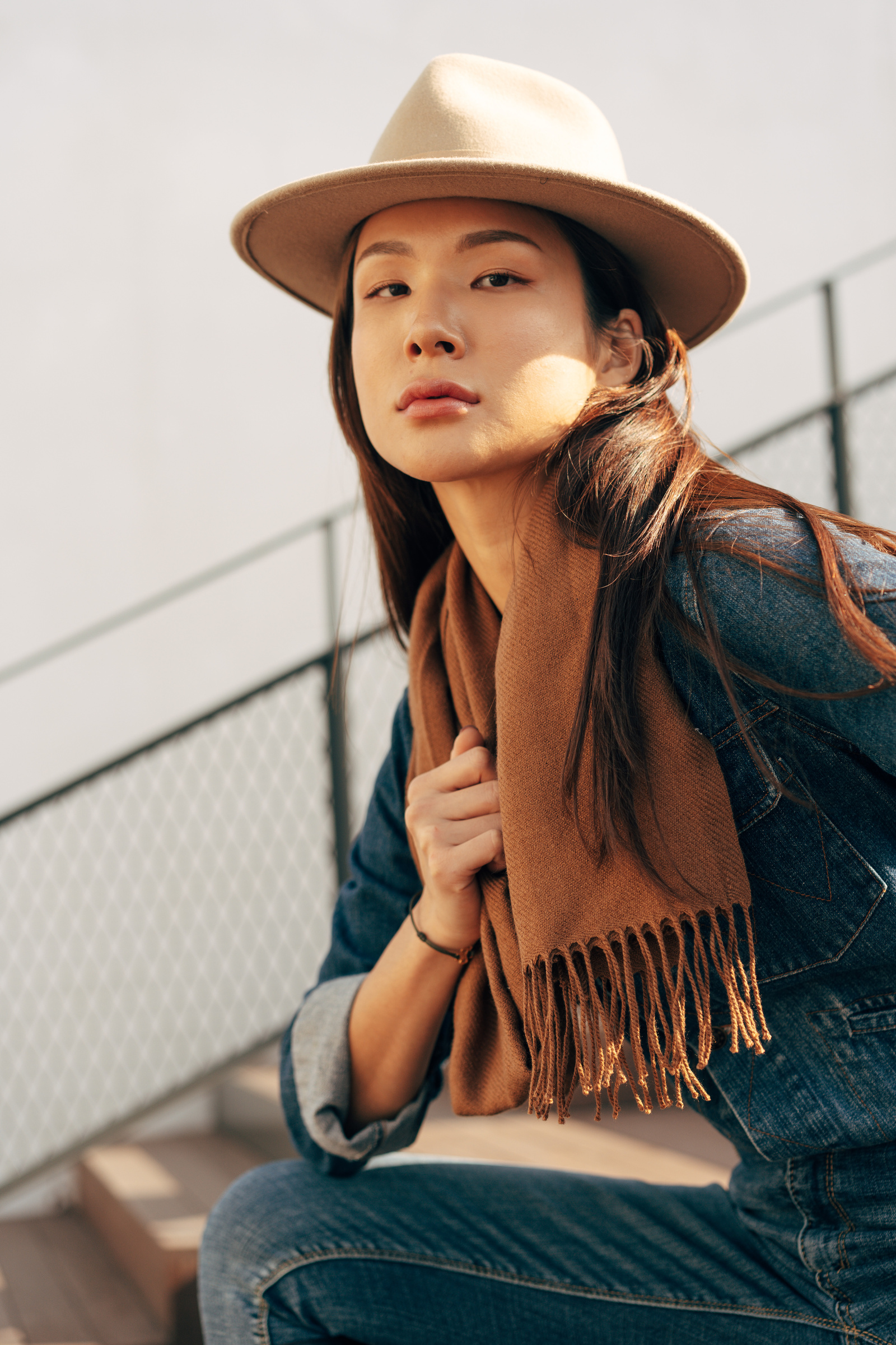 Woman in Denim Jacket, Scarf and Hat