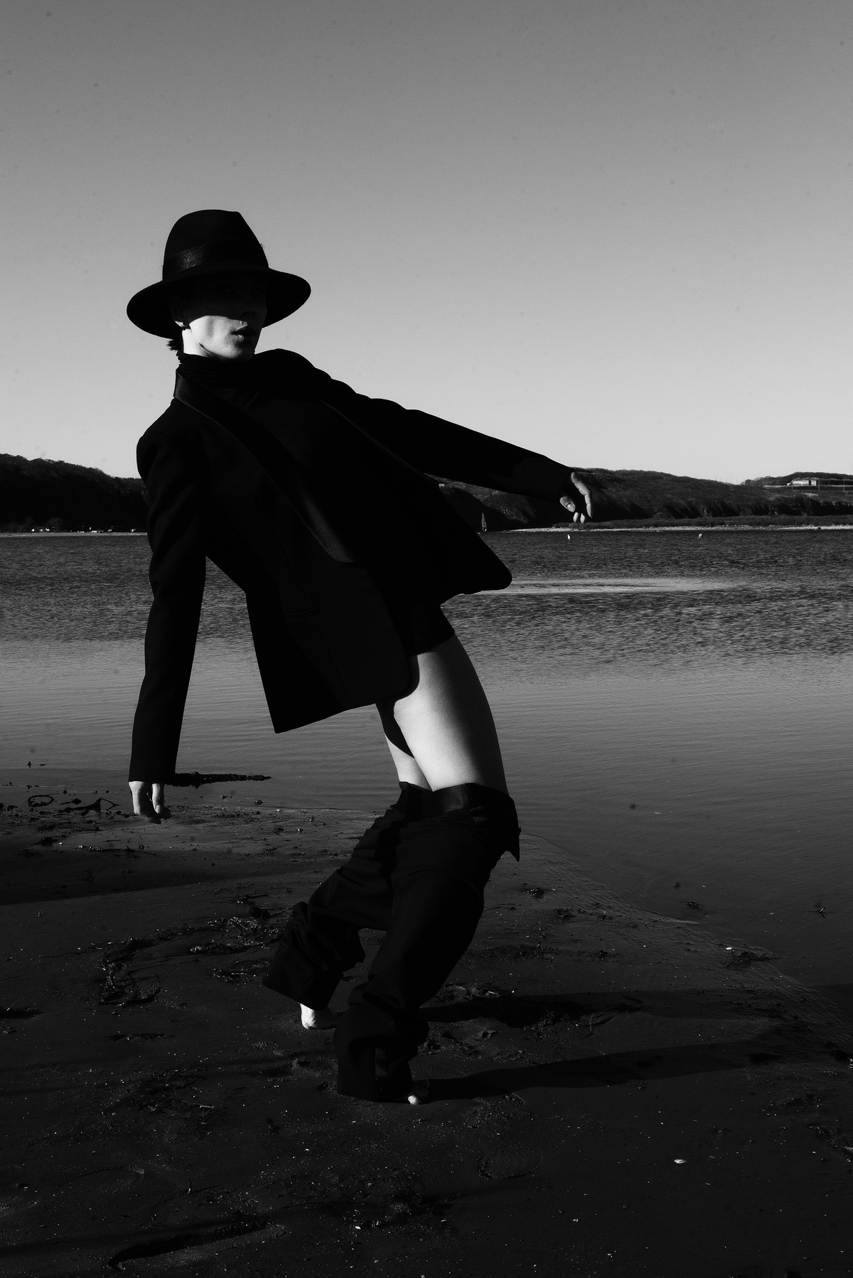 Black and White Photo of a Model Bending Her Back